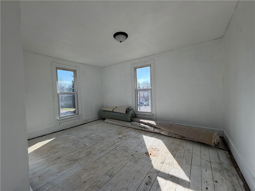 230 West Decatur Street Eaton, OH 45320 - Photo 15 of 22 This spacious room offers natural light and a classic wooden floor ready for your personal touch.