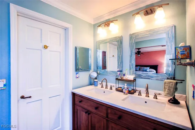a bathroom with a double vanity sink mirror and