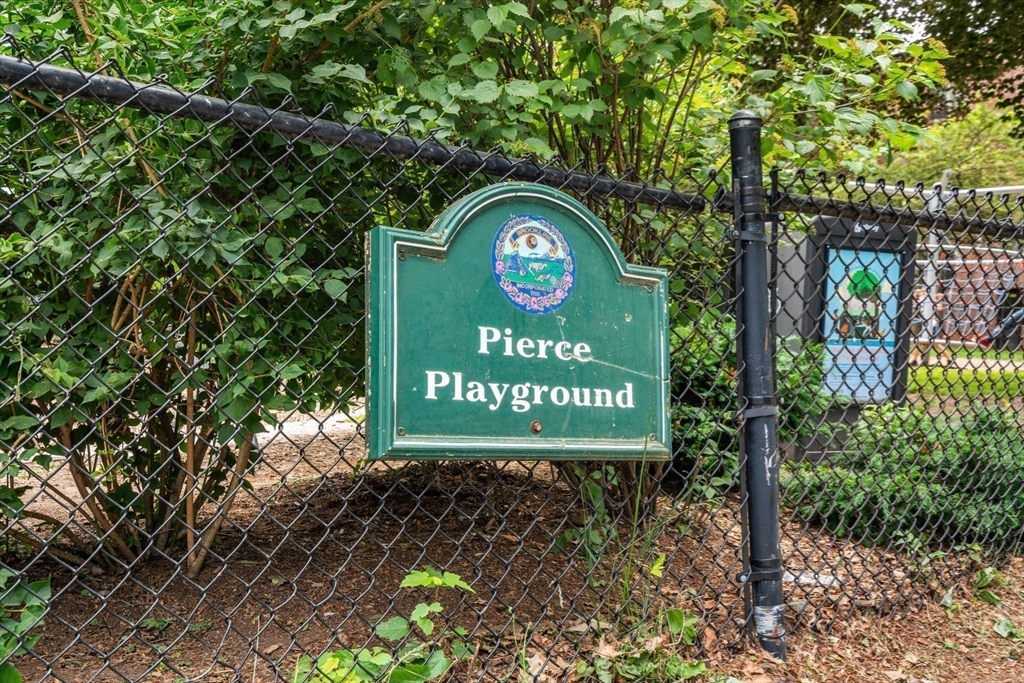 104 Harvard Street, Unit 6 Brookline, MA 02446 - Photo 18 of 18 a sign on the side of the road