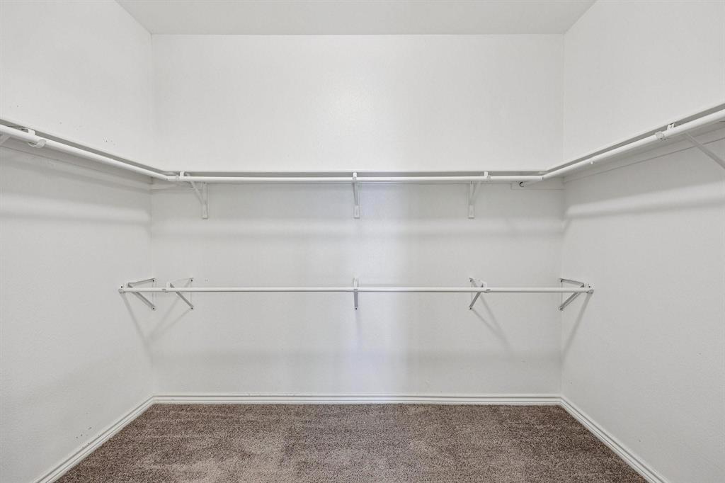 2712 Ryder Lane Aubrey, TX 76227 - Photo 14 of 26 a view of an empty walk in closet