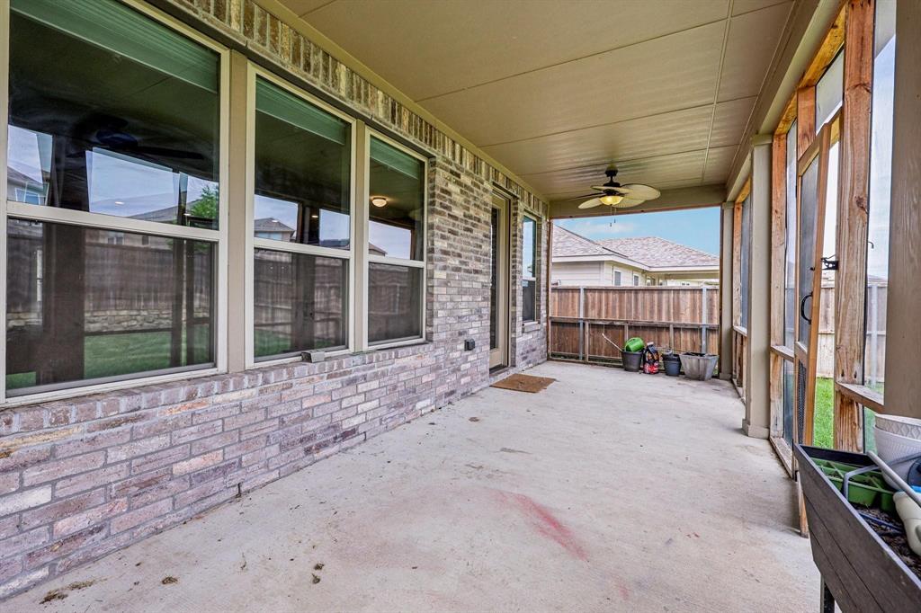 2712 Ryder Lane Aubrey, TX 76227 - Photo 24 of 26 a view of a house with a backyard