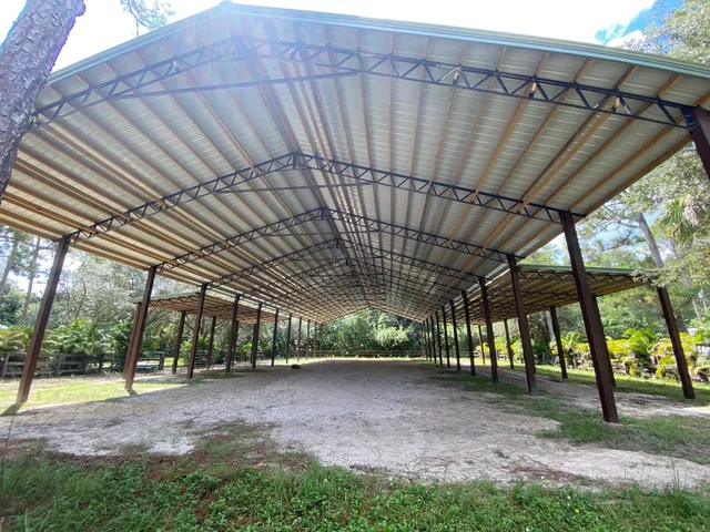 a view of a yard with an outdoor seating