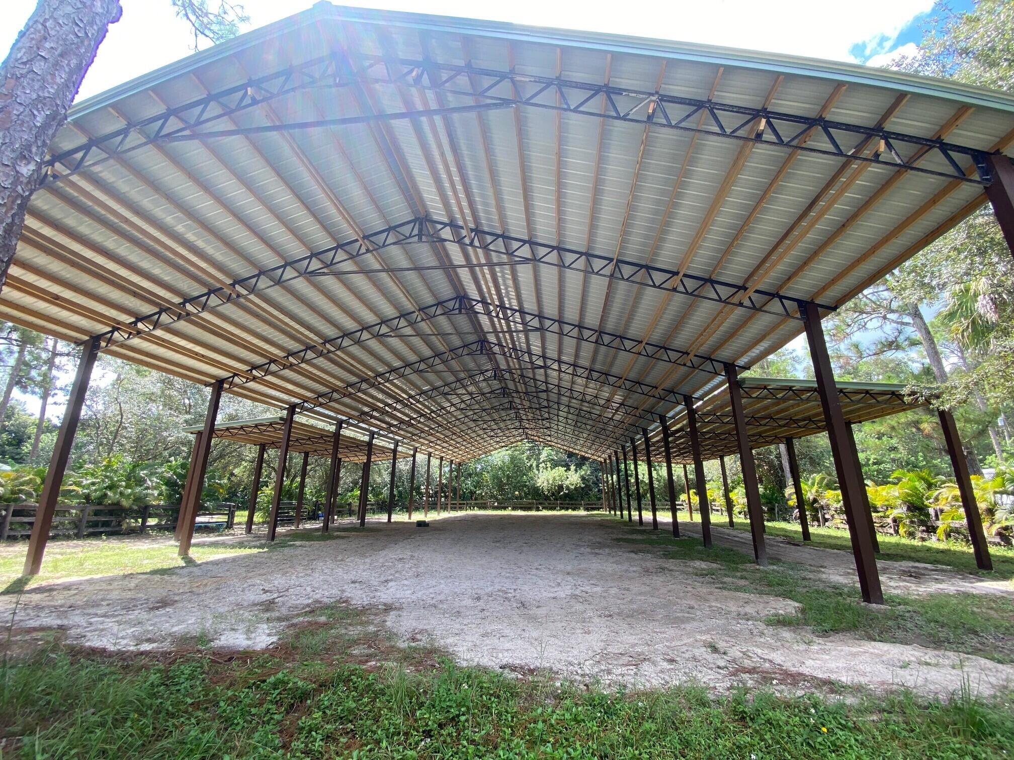 2141 B Road, Unit RV SPOT 2 Loxahatchee Groves, FL 33470 - Photo 16 of 37 a view of porch with green space