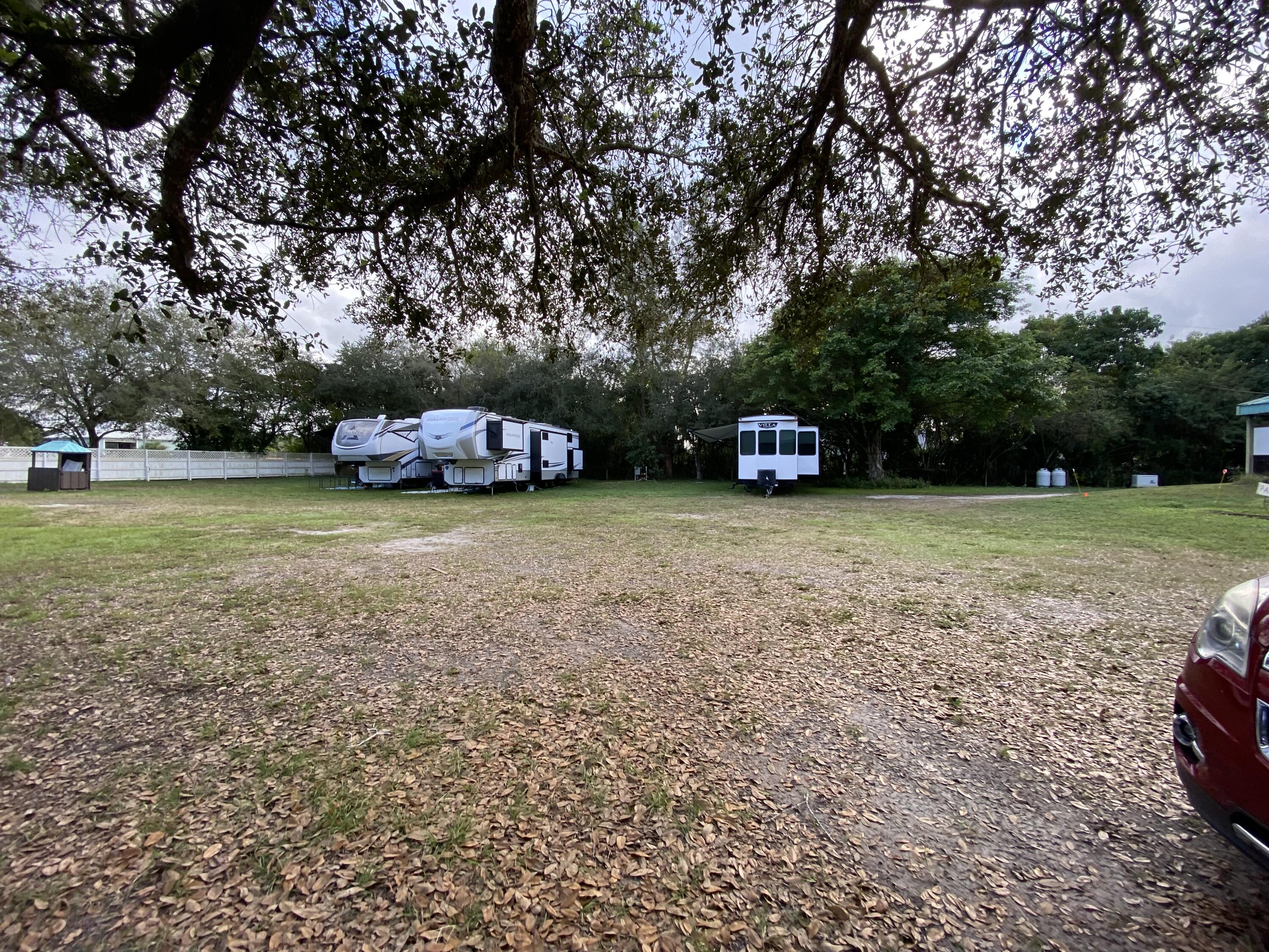2141 B Road, Unit RV SPOT 2 Loxahatchee Groves, FL 33470 - Photo 3 of 37 a view of a park with large trees