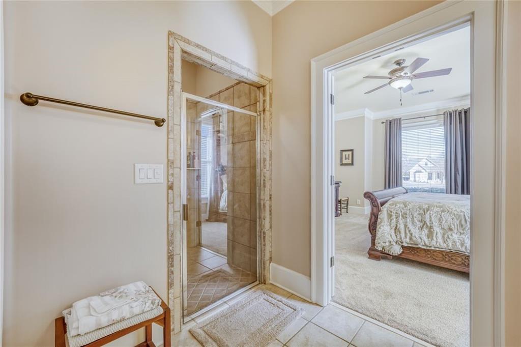2380 Muskogee Lane Braselton, GA 30517 - Photo 25 of 30 a bedroom with a bed and a bathroom