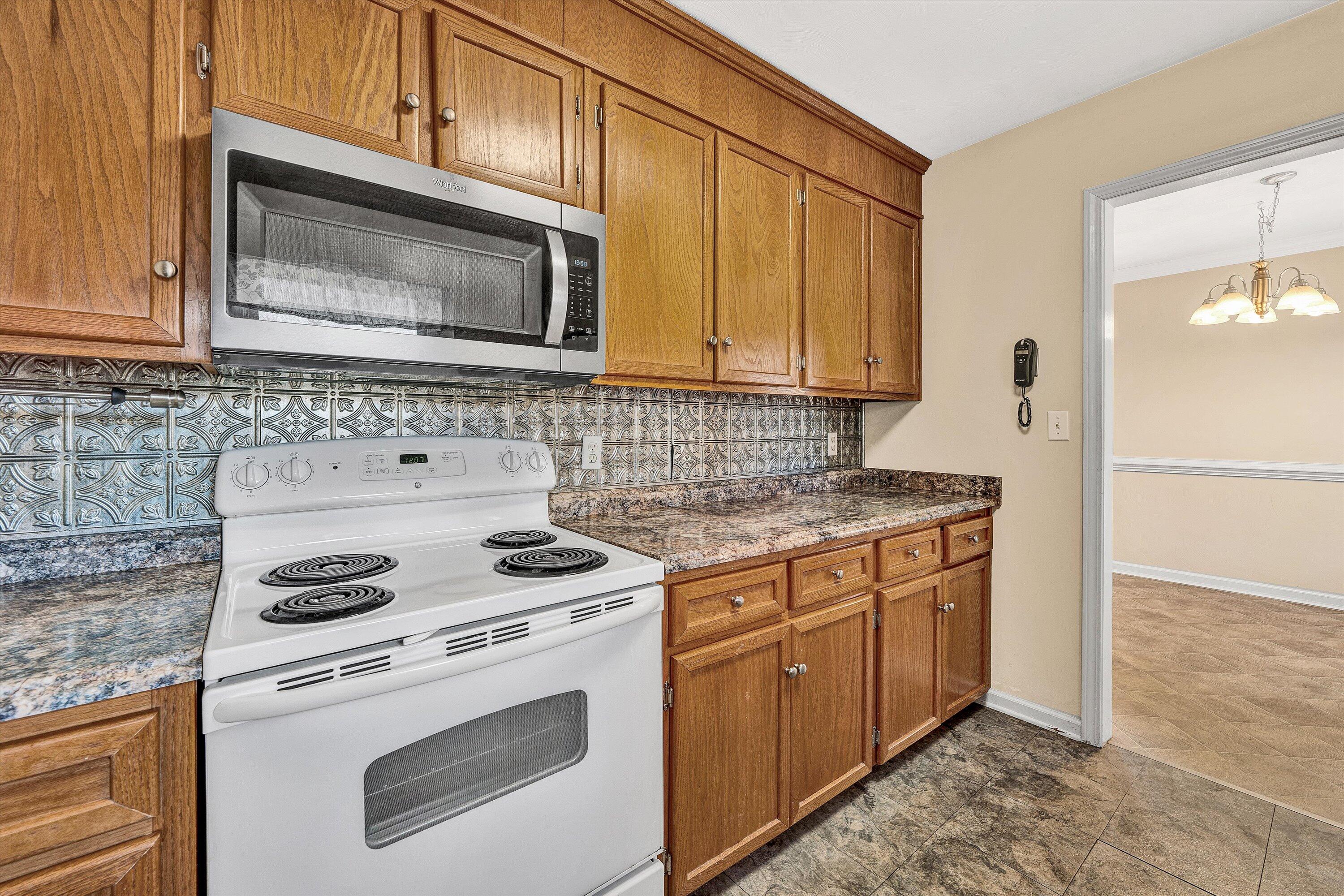 1060 Kessler Mill Road Salem, VA 24153 - Photo 8 of 31 a kitchen with a stove and a microwave