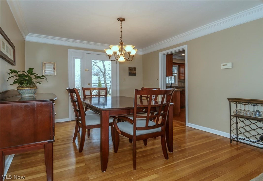 1143 Brainard Road Lyndhurst, OH 44124 - Photo 4 of 35 Dining Room with hard wood floor and double crown molding, door to deck.