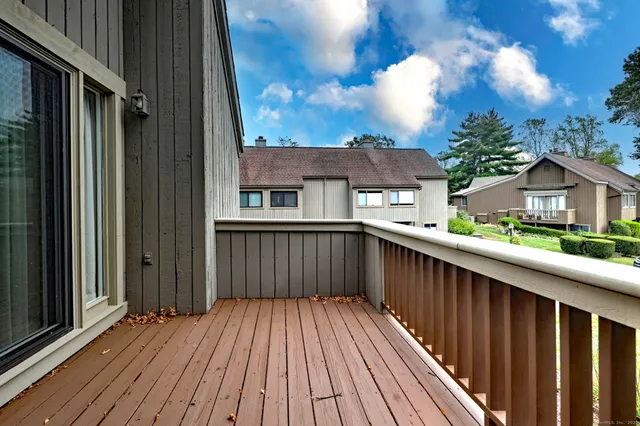 a balcony view with a hardwood floor