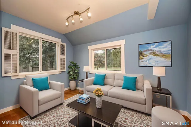 a living room with furniture and a large window