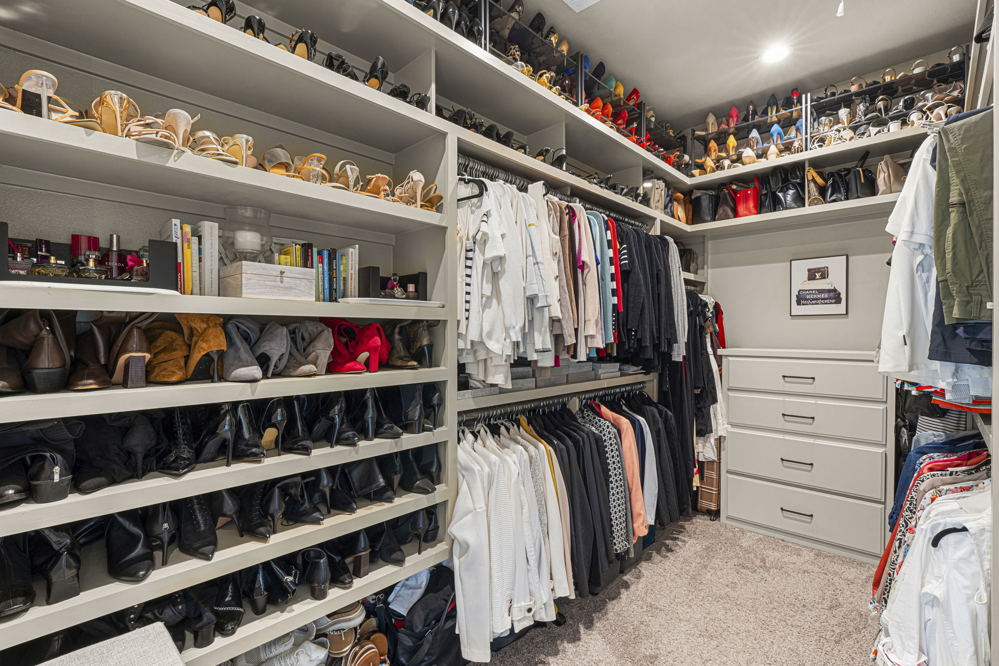 16202 Remuda Trail Buda, TX 78610 - Photo 15 of 40 Primary closet featuring extensive shelving, hanging space, built-in drawers, and recessed lighting