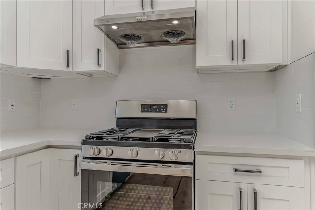 5825 View Circle Huntington Beach, CA 92649 - Photo 11 of 28 a stove top oven sitting inside of a kitchen