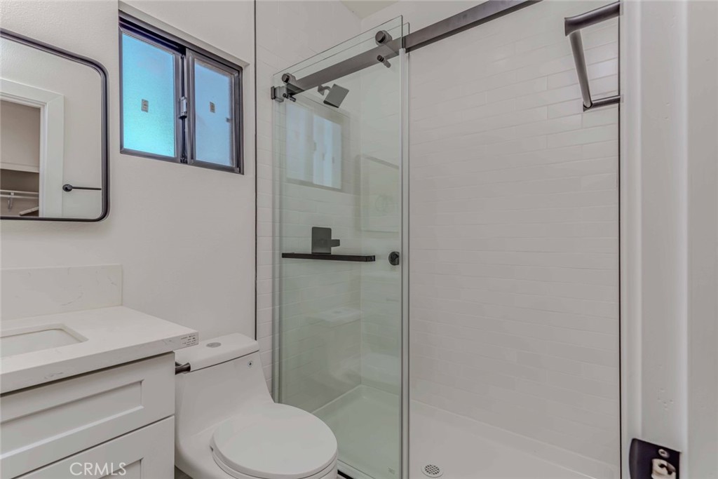 5825 View Circle Huntington Beach, CA 92649 - Photo 15 of 28 a white toilet sitting next to a bathroom sink