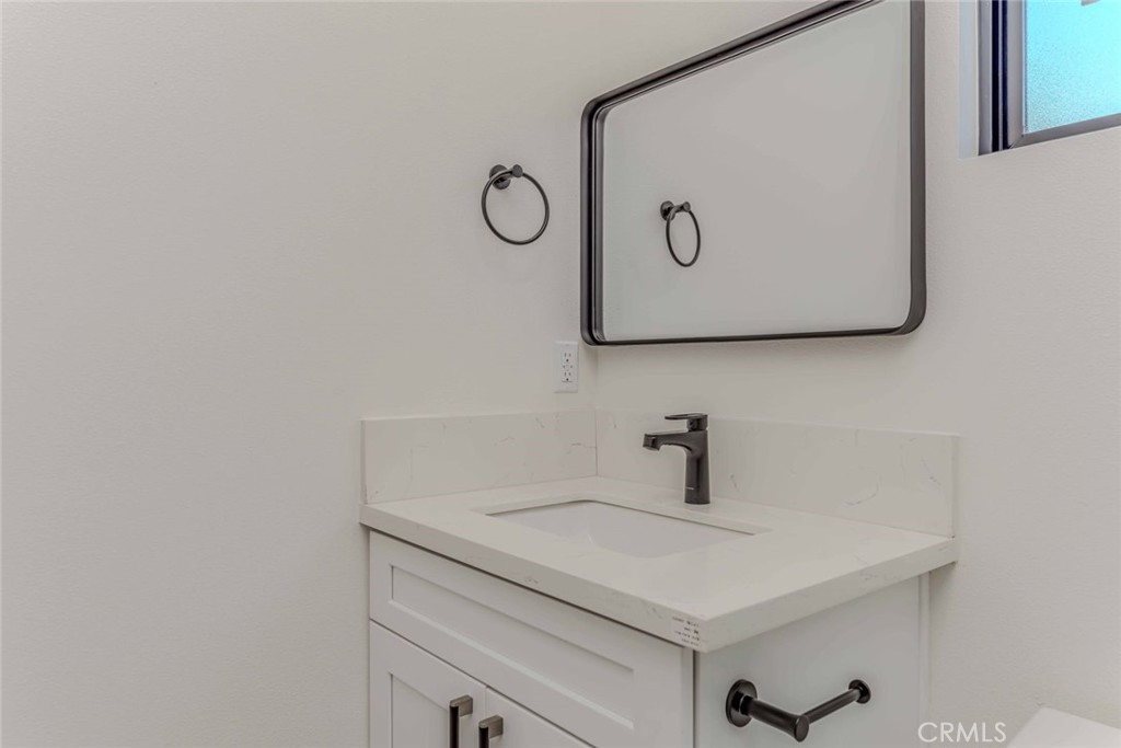 5825 View Circle Huntington Beach, CA 92649 - Photo 16 of 28 a bathroom with a sink and a mirror