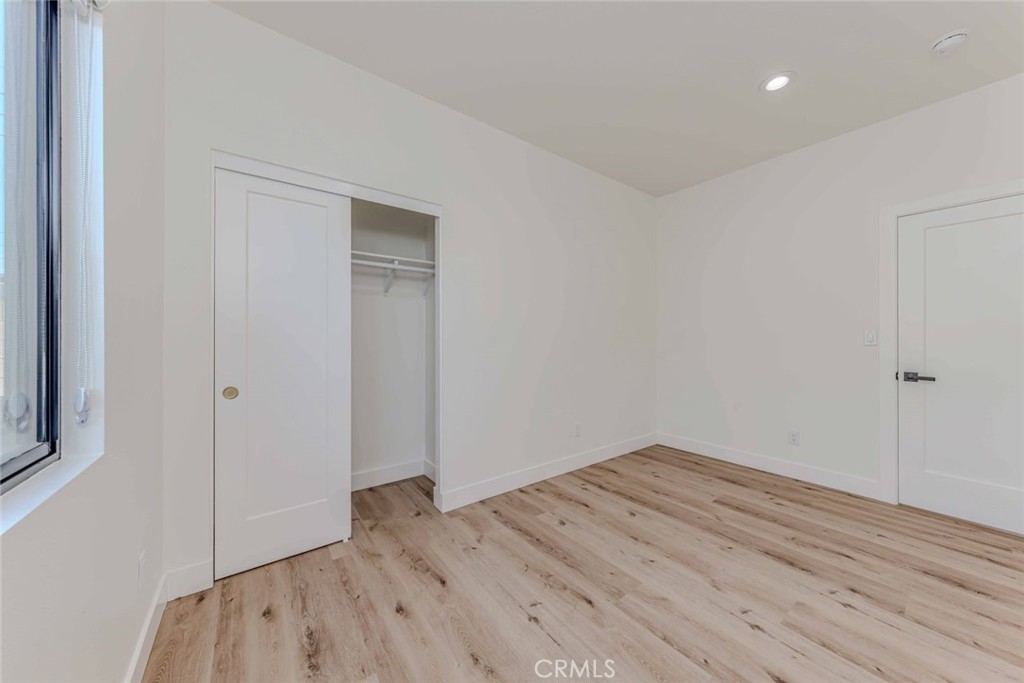 5825 View Circle Huntington Beach, CA 92649 - Photo 18 of 28 a view of room with wooden floor