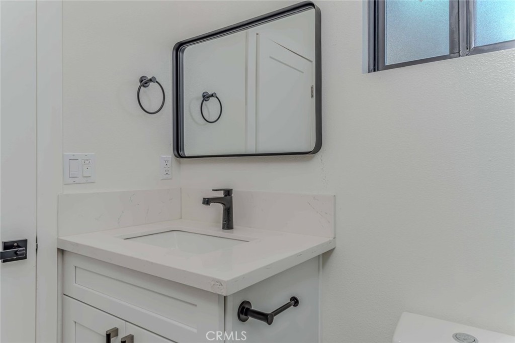 5825 View Circle Huntington Beach, CA 92649 - Photo 21 of 28 a bathroom with a sink and a vanity