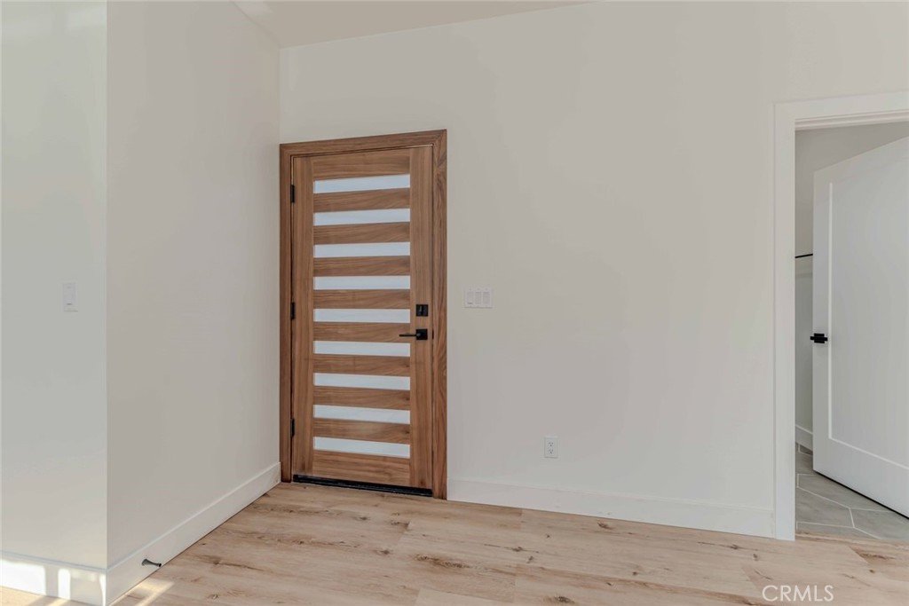 5825 View Circle Huntington Beach, CA 92649 - Photo 5 of 28 a view of a room with wooden floor