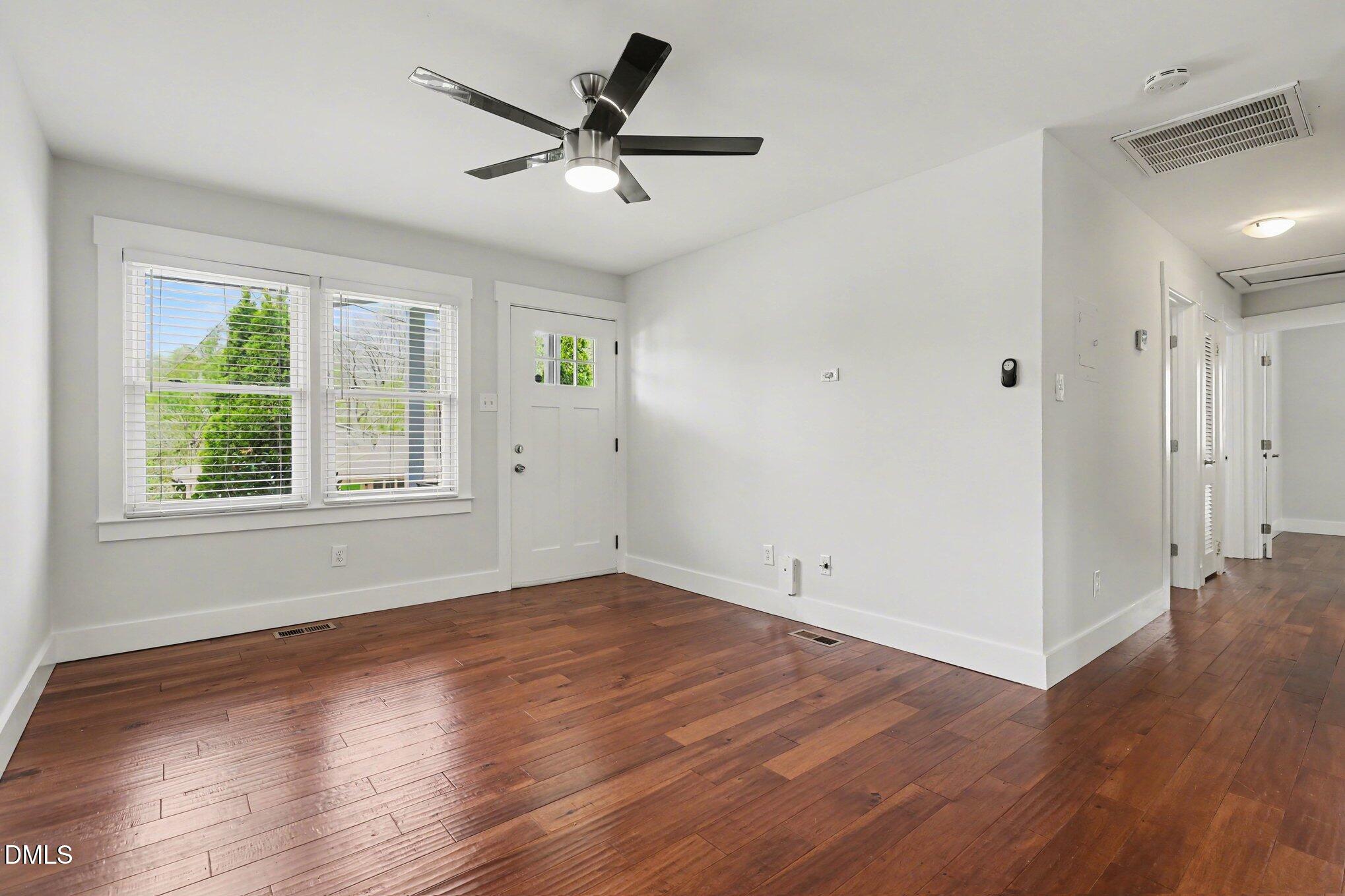 727 South State Street Raleigh, NC 27601 - Photo 6 of 30 an empty room with wooden floor and windows