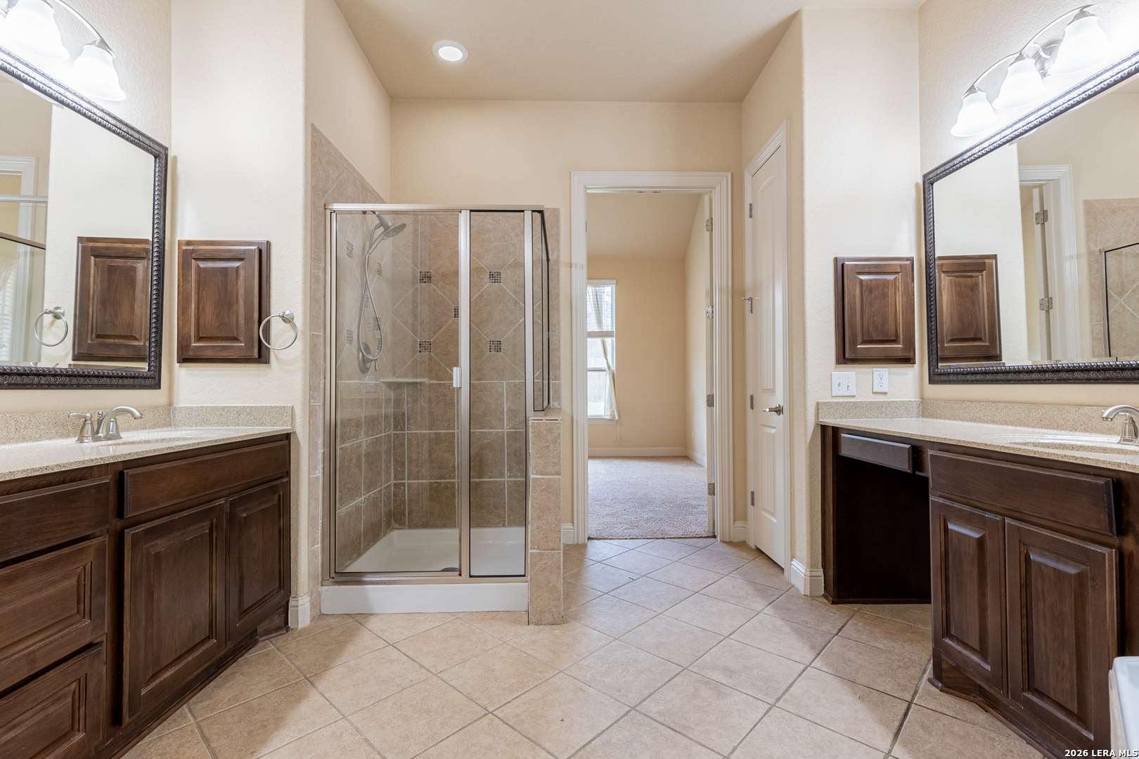 8103 Mystic Chase Boerne, TX 78015 - Photo 26 of 49 a spacious bathroom with a shower a sink and a mirror