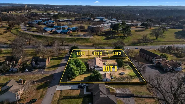 an aerial view of houses with yard