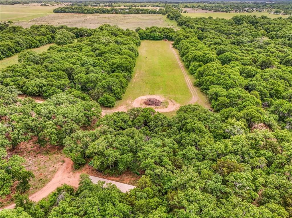 304 County Road 340 Ranger, TX 76470 - Photo 20 of 30 Expansive acreage featuring mature trees and a cleared central greenspace