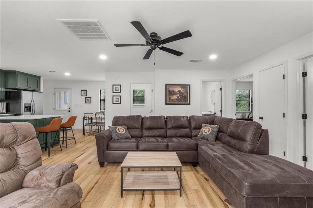 304 County Road 340 Ranger, TX 76470 - Photo 8 of 30 Open-concept living space featuring wood-finish flooring, recessed lighting, and a ceiling fan