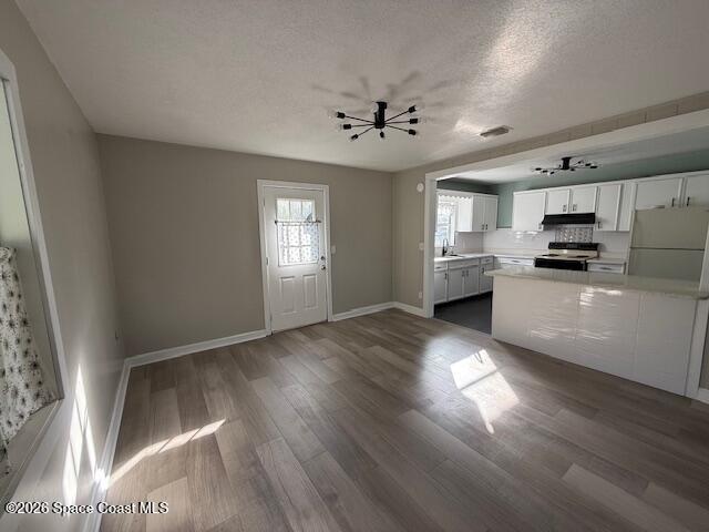 1925 Buffalo Road Titusville, FL 32796 - Photo 4 of 13 a kitchen with stainless steel appliances a refrigerator sink and microwave