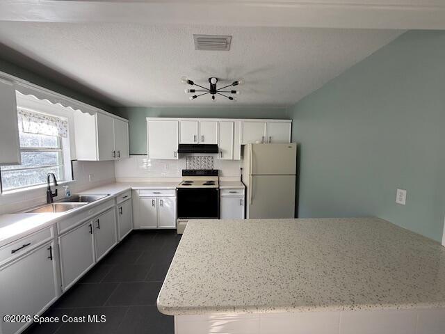 1925 Buffalo Road Titusville, FL 32796 - Photo 5 of 13 a large kitchen with cabinets