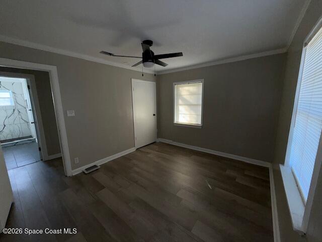 1925 Buffalo Road Titusville, FL 32796 - Photo 7 of 13 an empty room with wooden floor and windows