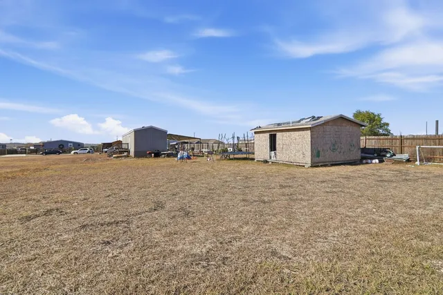 a big room with yard and ocean view
