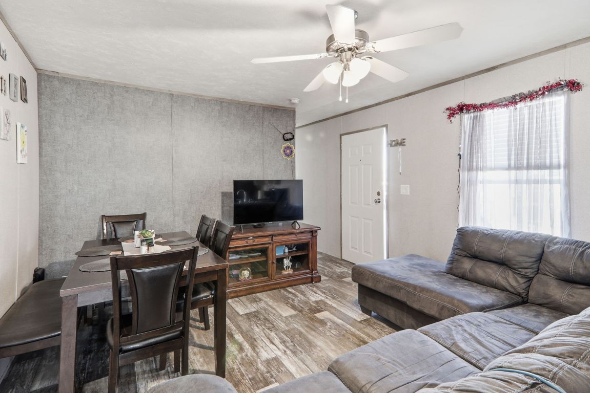 1130 Rustler Pass Kyle, TX 78640 - Photo 4 of 21 Living room featuring light wood finished floors and a ceiling fan