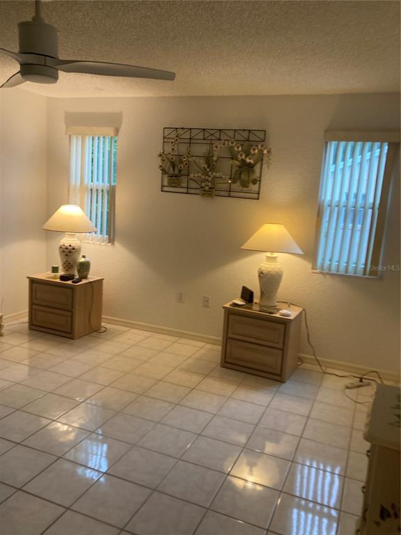 8744 Southwest 108th Ln Road Ocala, FL 34481 - Photo 6 of 28 a living room with furniture and a table
