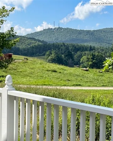 a balcony with an outdoor space and mountain view