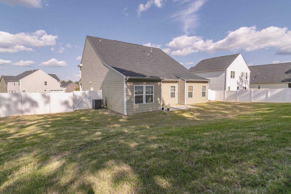 202 Bronson Ridge Anderson, SC 29621 - Photo 10 of 38 A spacious backyard with a well-maintained lawn, perfect for outdoor activities and relaxation.