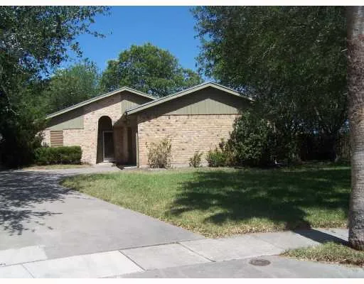 a view of a wooden house with a yard