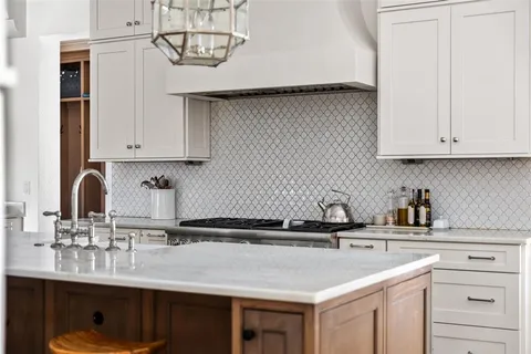 a kitchen with a sink cabinets and stainless steel appliances
