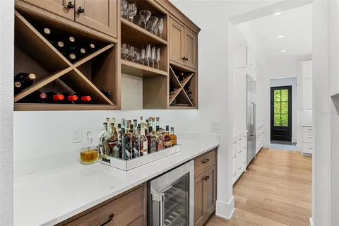 an entryway with wooden floor