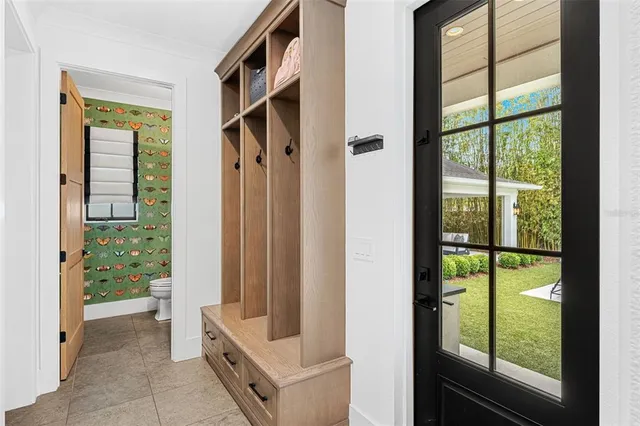 a bathroom with a sink and mirror with toilet