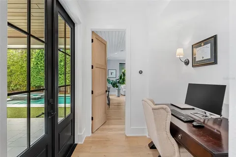 a bed room with a bed and a large window