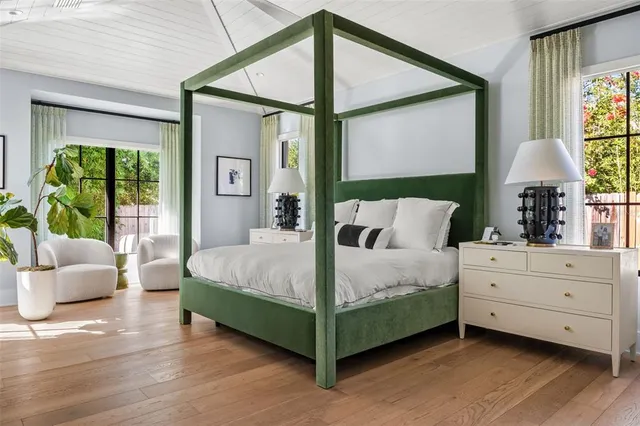 a bedroom with furniture and a potted plant