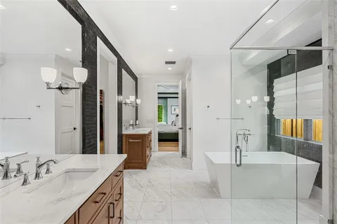 a bathroom with a shower a sink and a mirror