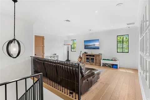a living room with furniture window and wooden floor