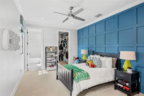 a bathroom with a bathtub shower sink vanity mirror and toilet