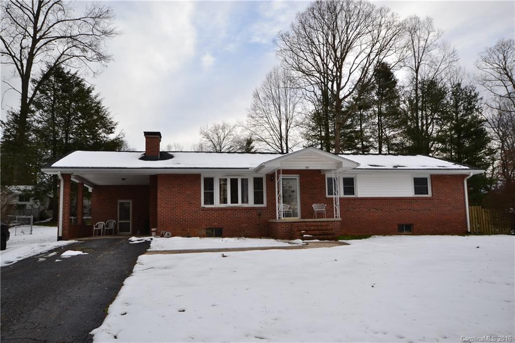 445 Loop Road Hendersonville, NC 28792 - Photo 1 of 13 a front view of a house with a yard