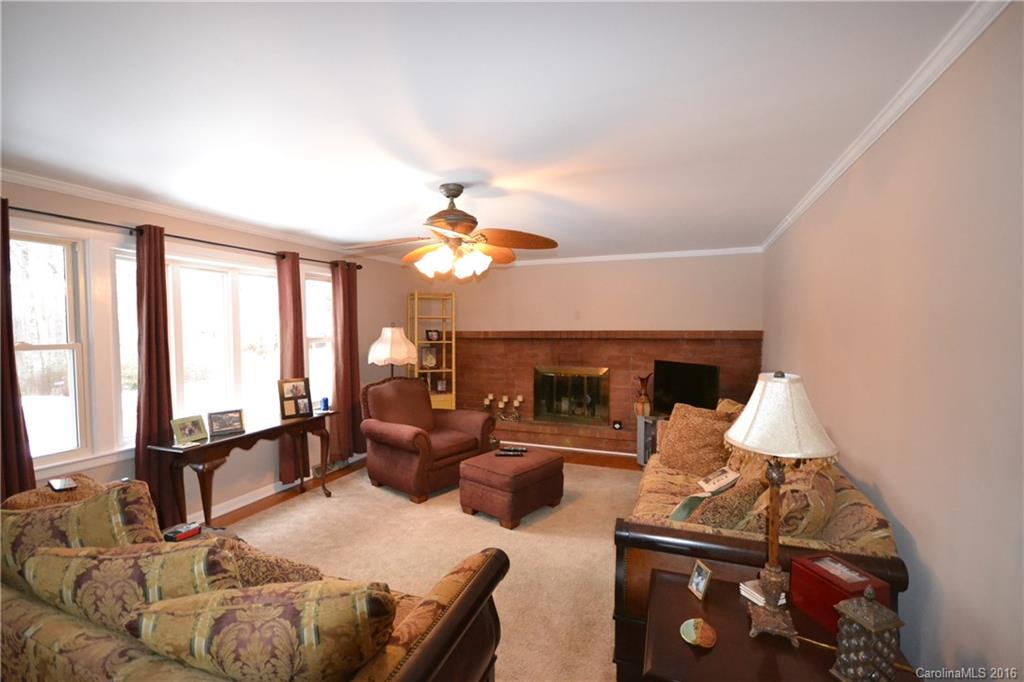 445 Loop Road Hendersonville, NC 28792 - Photo 2 of 13 a living room with furniture and a fireplace