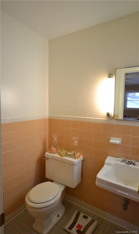 445 Loop Road Hendersonville, NC 28792 - Photo 11 of 13 view of bathroom with mirror and window
