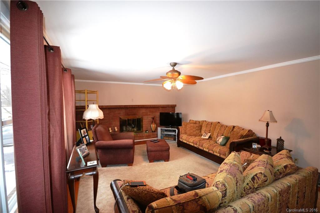 445 Loop Road Hendersonville, NC 28792 - Photo 3 of 13 a living room with furniture and a couch