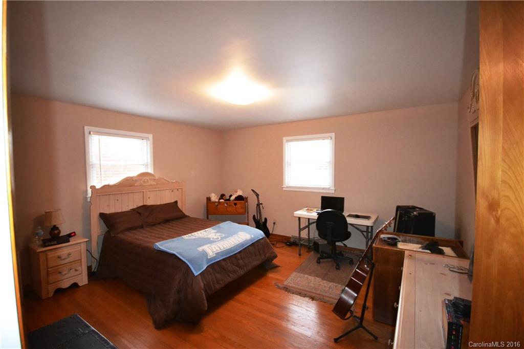 445 Loop Road Hendersonville, NC 28792 - Photo 5 of 13 a living room with furniture and a window