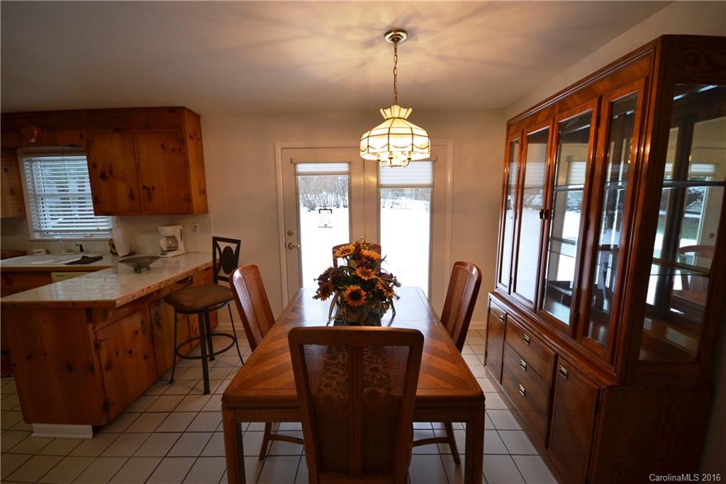 445 Loop Road Hendersonville, NC 28792 - Photo 8 of 13 a view of a dining room with furniture window and outside view