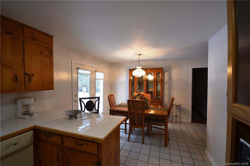 445 Loop Road Hendersonville, NC 28792 - Photo 9 of 13 a view of a dining room with furniture