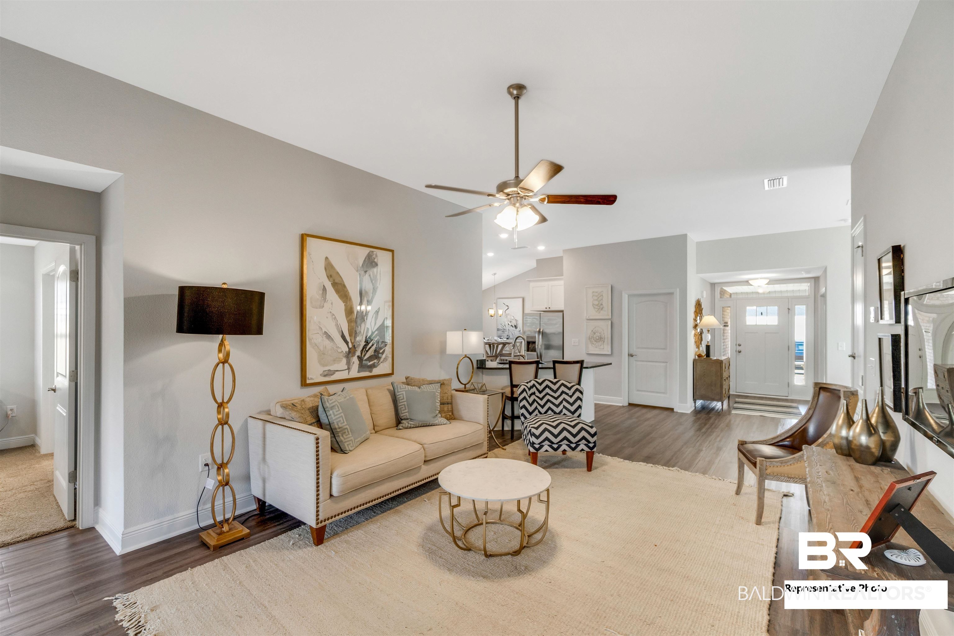 643 Mayflower Drive Foley, AL 36535 - Photo 21 of 34 Living area with lofted ceiling, baseboards, a ceiling fan, and wood finished floors